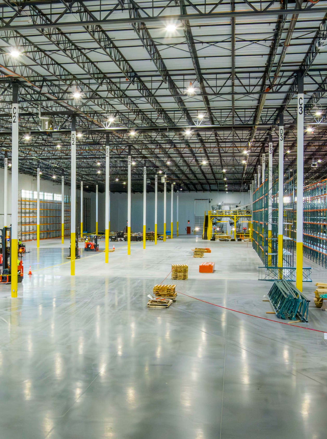 Polished concrete warehouse floor between pallet racking aisles at the Moen distribution facility.